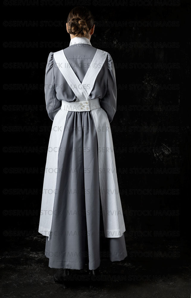 World War 1 nurse in grey uniform dress with a white apron (Sarah562) Servian Stock Images World War 1 nurse in grey uniform dress with a white apron (Sarah562) Servian Stock Images