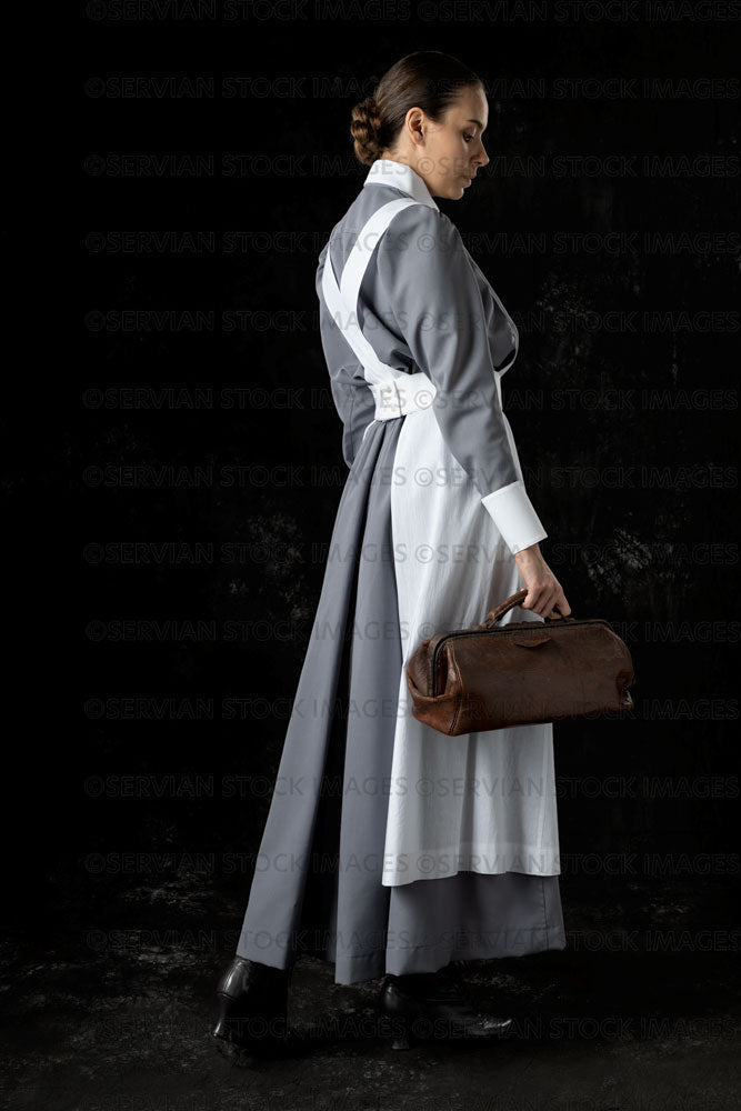 World War 1 nurse in grey uniform dress with a white apron (Sarah570) Servian Stock Images World War 1 nurse in grey uniform dress with a white apron (Sarah570) Servian Stock Images