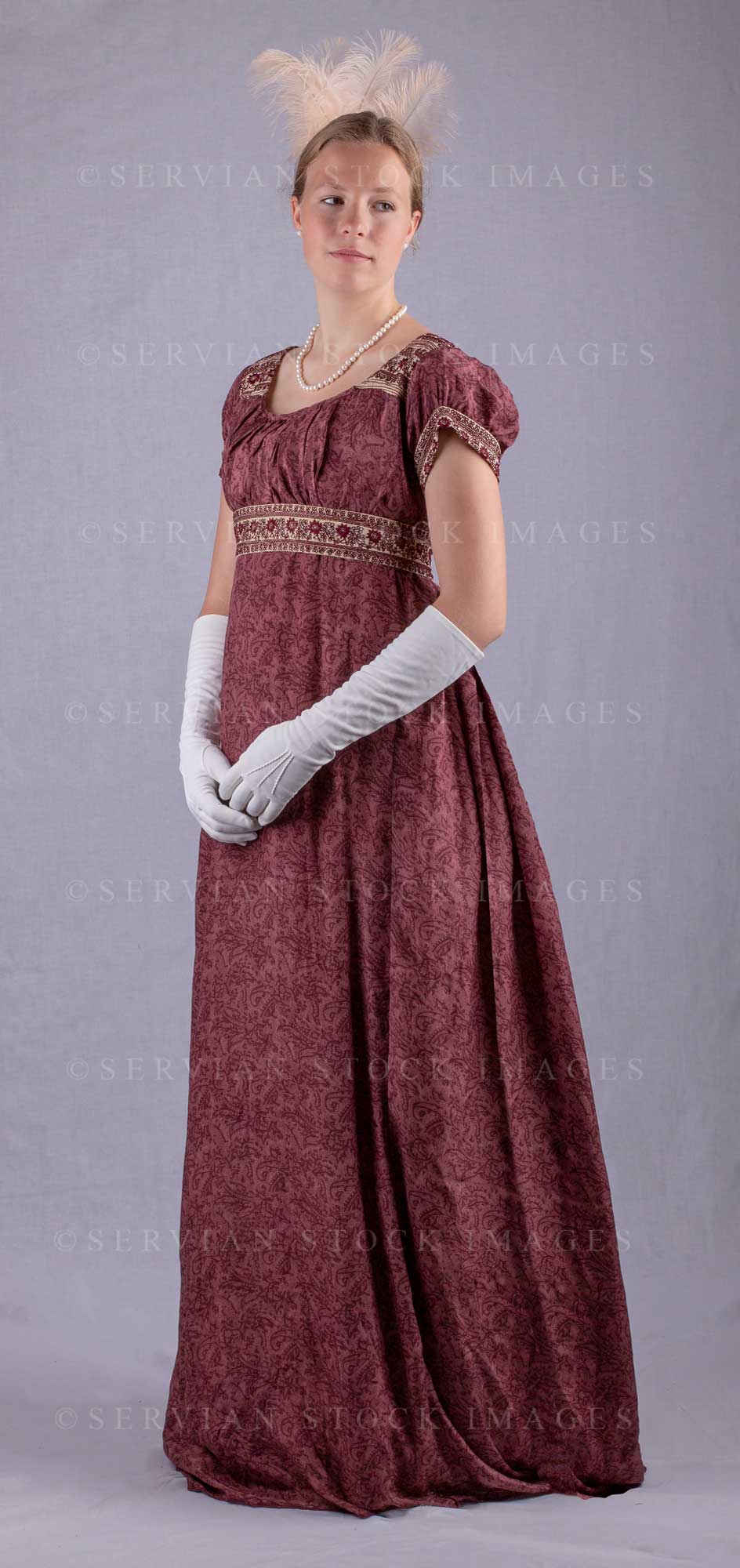 Regency woman wearing a red silk embroidered dress and long gloves (Sk –  Servian Stock Images