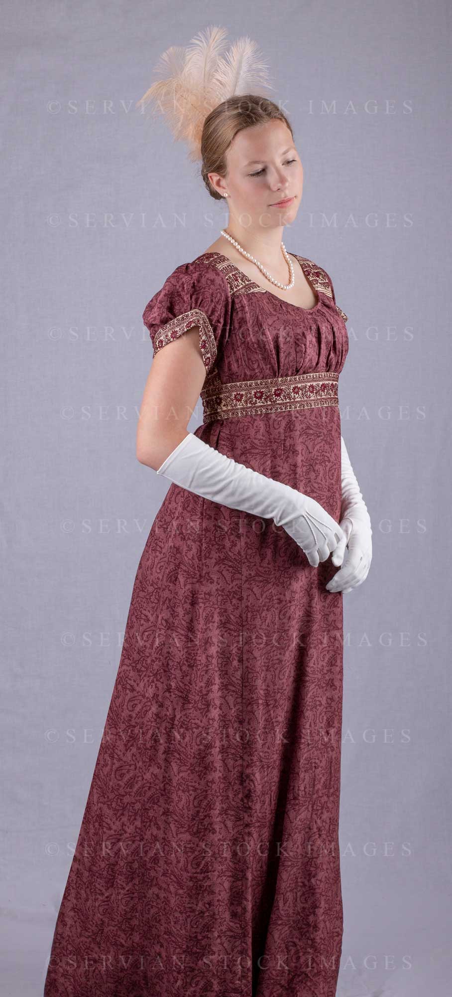 Regency woman wearing a red silk embroidered dress and long gloves (Sk –  Servian Stock Images