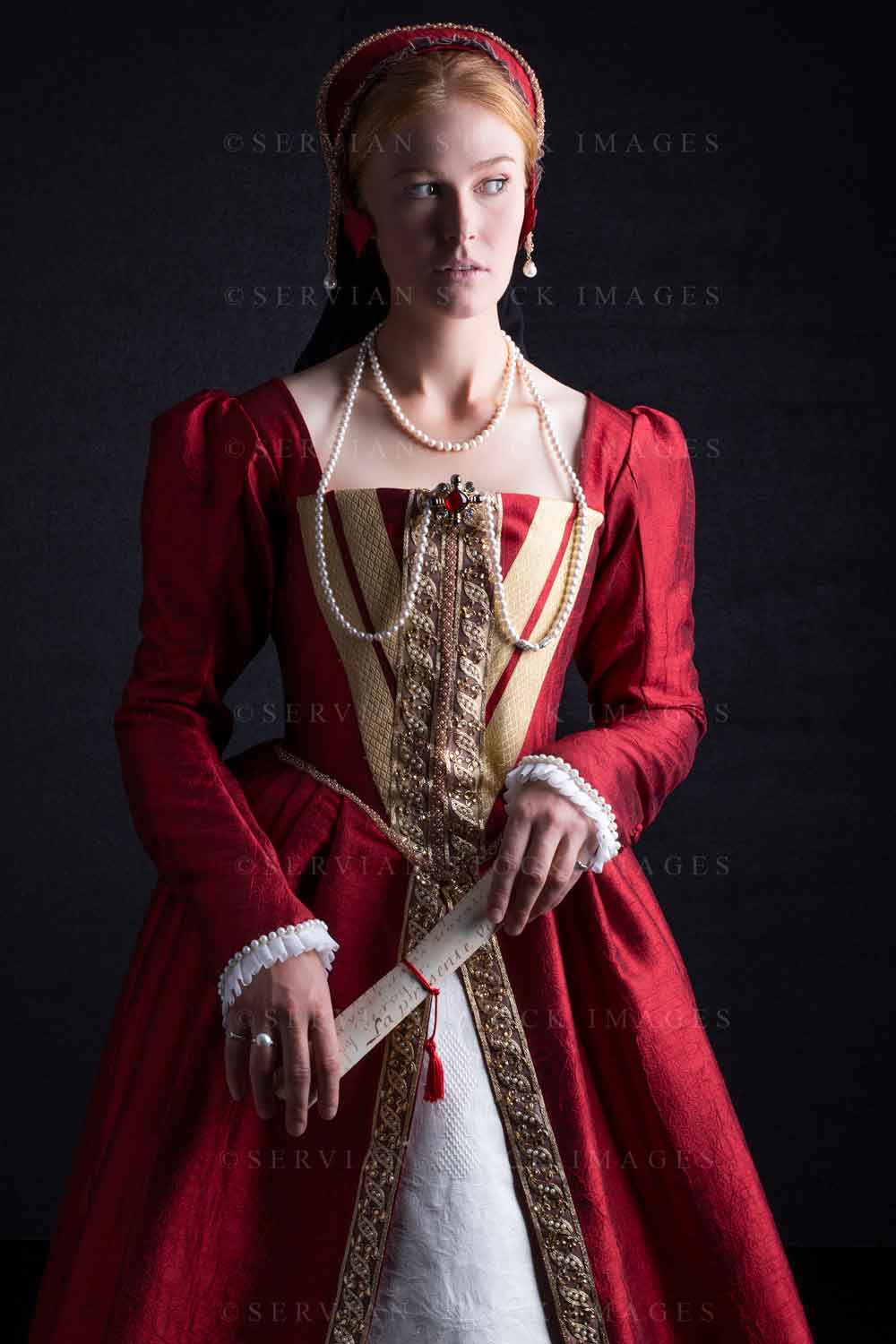 Tudor woman in an ornate red dress (Lauren 0232) Servian Stock Images Tudor woman in an ornate red dress (Lauren 0232) Servian Stock Images