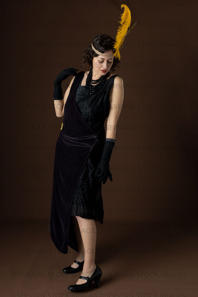 1920s woman wearing an evening dress with long black gloves (Emma 303) –  Servian Stock Images