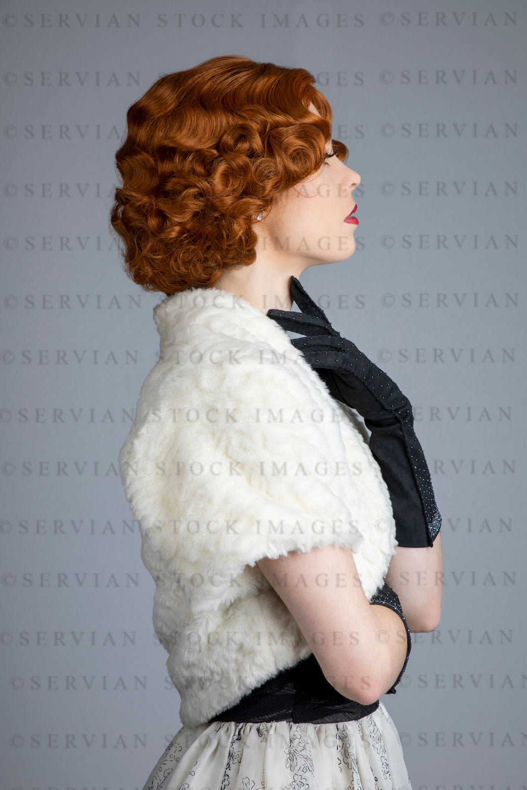1950s woman in vintage dress, white fur shrug, and black gloves (Lacey 2531)