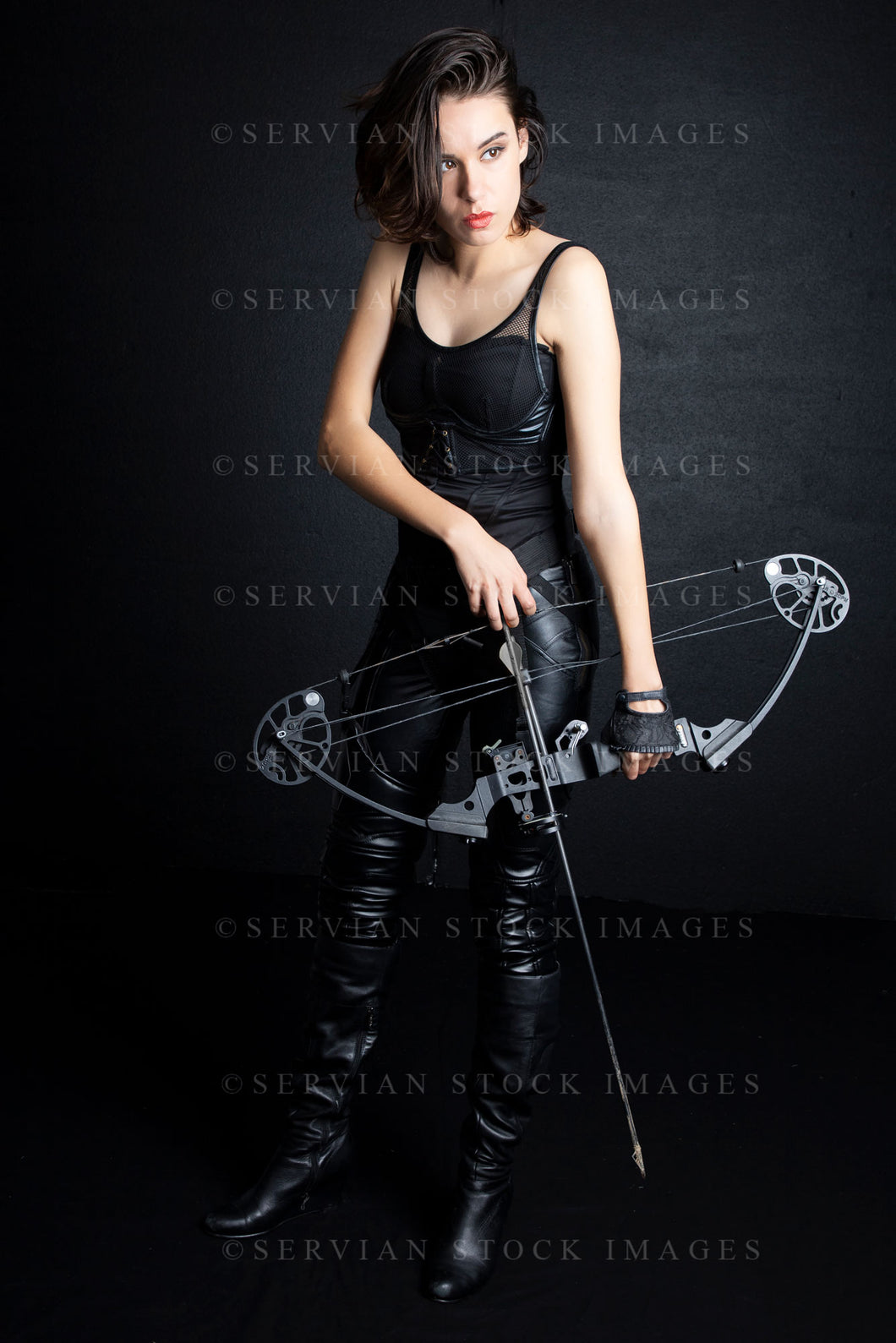 Urban fantasy woman with short dark, hair holding a bow and arrow (Sarah 9690)