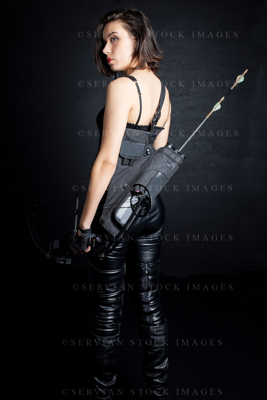 Urban fantasy woman with short dark, hair holding a bow and arrow (Sarah 9713)