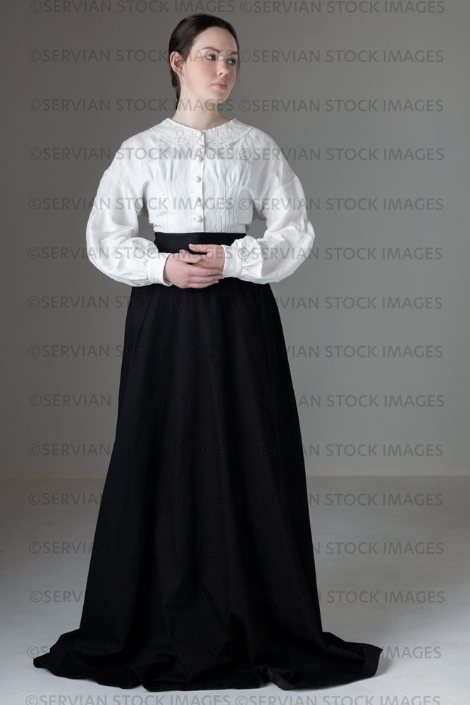 Young Victorian / Edwardian woman wearing a white linen blouse and black skirt (Kate 556)