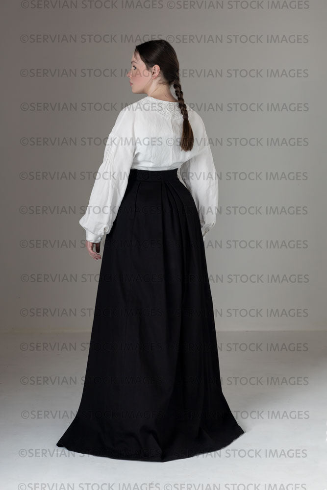 Young Victorian / Edwardian woman wearing a white linen blouse and black skirt (Kate 570)