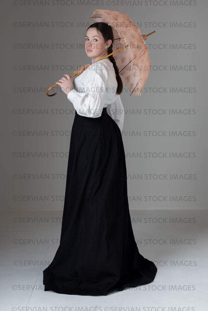 Young Victorian / Edwardian woman wearing a white linen blouse and black skirt (Kate 574)