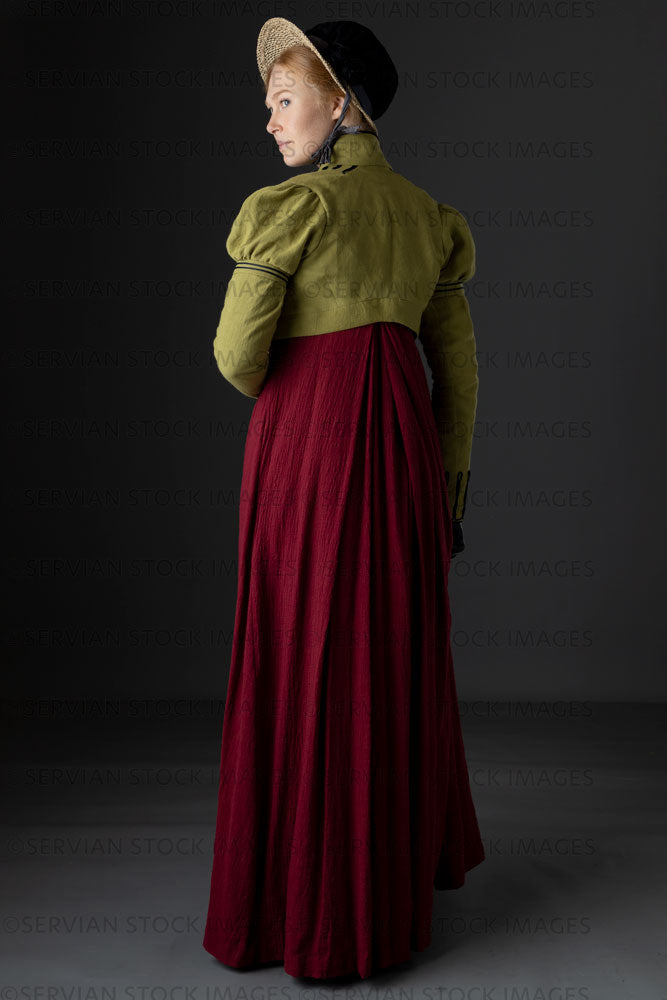 Regency woman wearing a red dress with a green linen spencer and bonnet  (Lauren 0760)