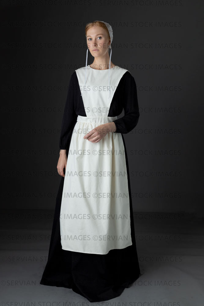 Amish woman wearing a black dress with a white apron and cap (Lauren 0780) Amish woman wearing a black dress with a white apron and cap (Lauren 0780)