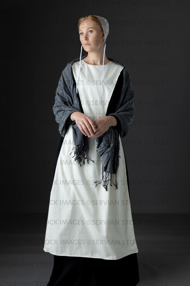Amish woman wearing a black dress with a white apron and cap (Lauren 0808) Amish woman wearing a black dress with a white apron and cap (Lauren 0808)