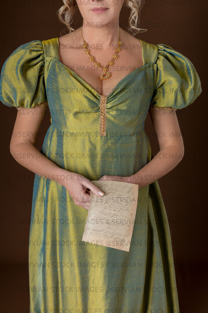 Regency woman wearing a green shot silk dress and turban (Sherilyn 2713)
