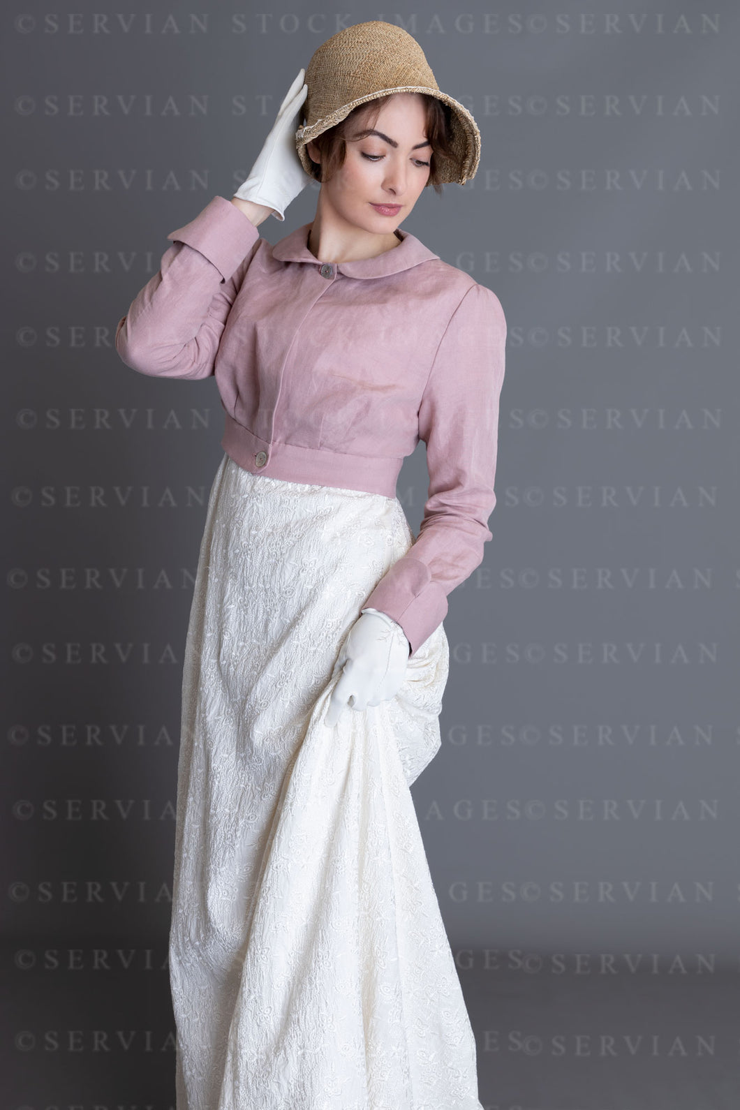 Regency woman in a cream embroidered dress and pink linen short spencer (Clarese 3559)