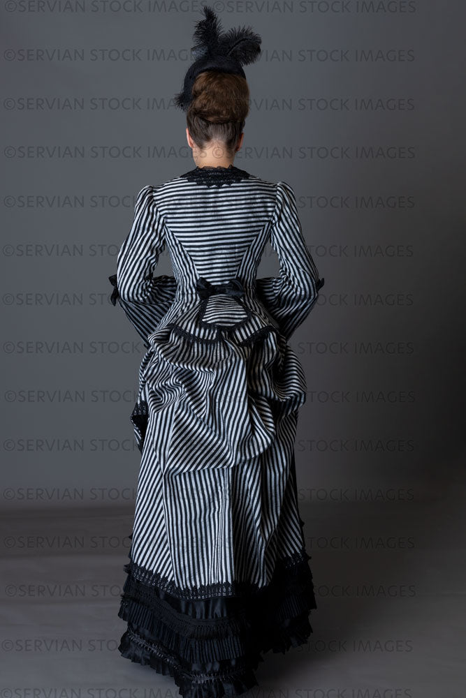 Victorian woman in a striped silk 1870s bustle ensemble (Sarah 8814) –  Servian Stock Images