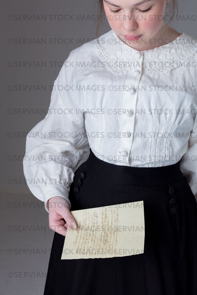 Young Victorian / Edwardian woman wearing a white linen blouse and black skirt (Kate 9684 )