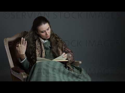 Victorian woman wearing a dark green check bodice and skirt sits in a chair reading a book   (Sarah 1734)