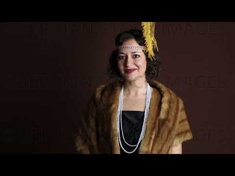 1920s woman wearing an evening dress and a fur stole  (Emma 4023)
