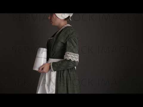 Victorian maid servant wearing a dark green check bodice and skirt with an apron and cap   (Sarah 1719)