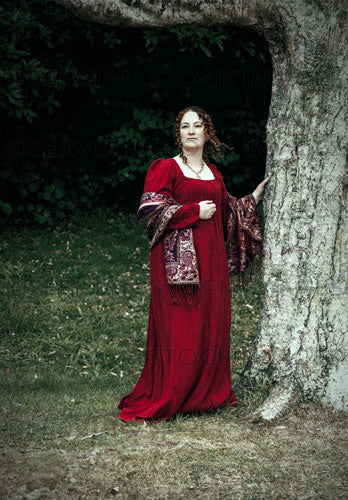 Regency woman wearing a red dress and standing by a tree (Agnes 6787)