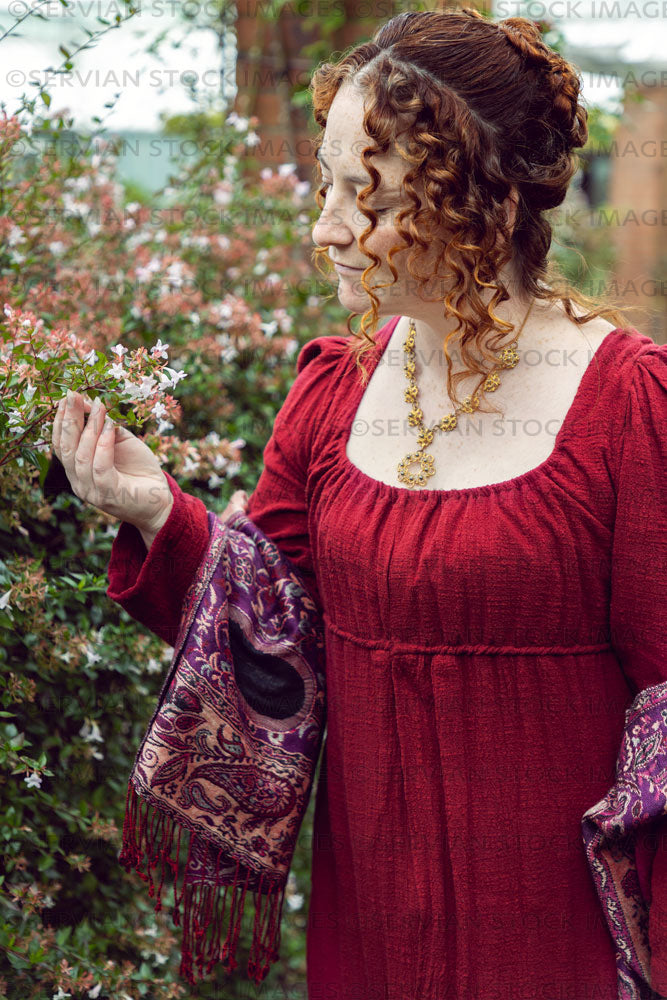 Regency woman wearing a red dress in a garden (Agnes 6800)