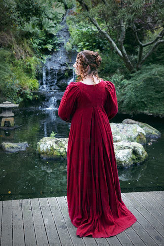 Regency woman wearing a red dress in a garden (Agnes 6891)