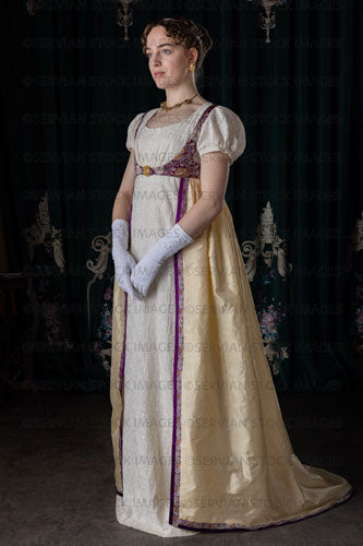 Regency woman wearing an embroidered dress and long spencer (Viola 7031)