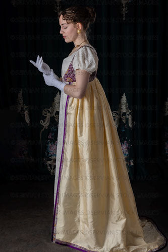 Regency woman wearing an embroidered dress and long spencer (Viola 7035)