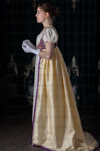 Regency woman wearing an embroidered dress and long spencer (Viola 7036)