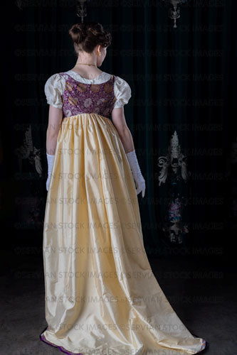 Regency woman wearing an embroidered dress and long spencer (Viola 7039)