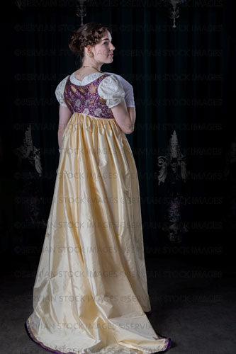 Regency woman wearing an embroidered dress and long spencer (Viola 7042)