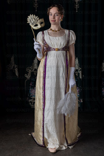 Regency woman wearing evening dress and holding a feather fan and mask (Viola 7076)