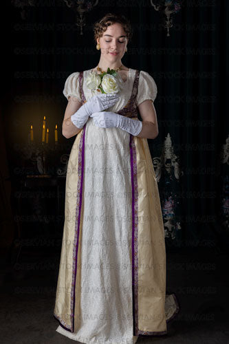 Regency woman wearing an evening dress and holding roses (Viola 7124)