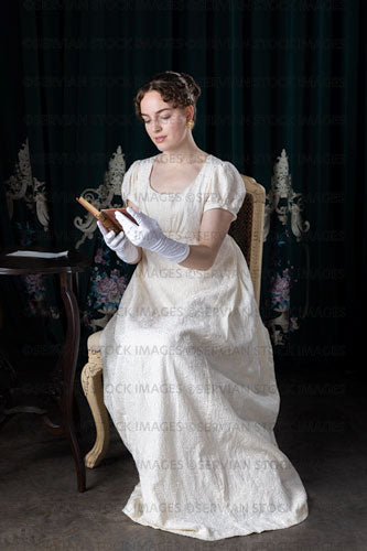 Regency woman sitting and reading a book (Viola 7239)