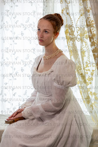 Regency woman wearing a cotton dress and surrounded by lace curtains (Liv 7970)