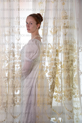 Regency woman wearing a cotton dress and surrounded by lace curtains (Liv 7986)