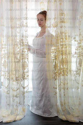 Regency woman wearing a cotton dress and surrounded by lace curtains (Liv 8022)