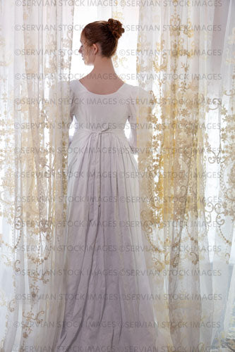 Regency woman wearing a cotton dress and surrounded by lace curtains (Liv 8040)