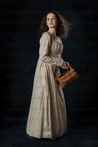 Regency woman wearing a cotton dress with her hair blowing in the wind (Brigit 8528)