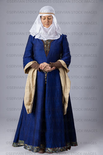 Medieval woman wearing a blue silk bliaut gown with a white wimple  (Emma 1239)