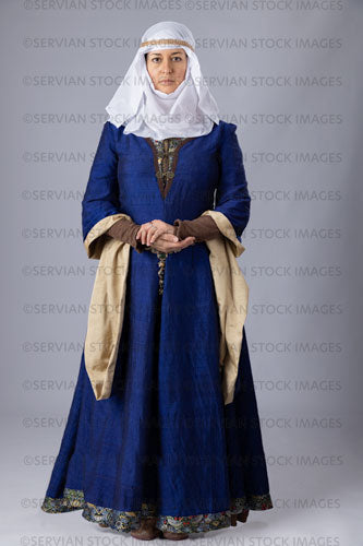 Medieval woman wearing a blue silk bliaut gown with a white wimple  (Emma 1240)