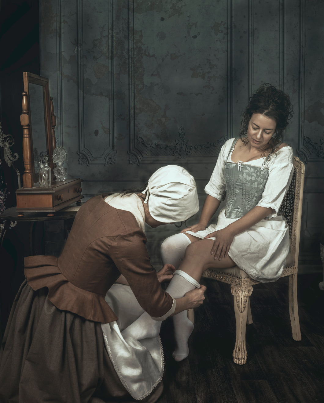 Georgian 18th century woman being dressed by her maid (emma and Tessa 6720)