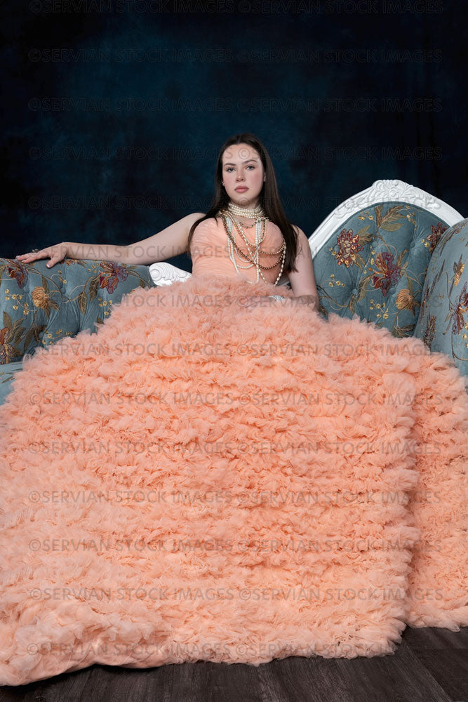 Young woman wearing a ballgown on a chaise (Kate8175)