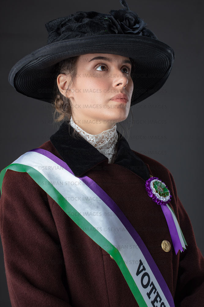 United Kingdom Suffragette from late 19th / early 20th century wearing a black hat and winter coat (SARAH 1015UK)