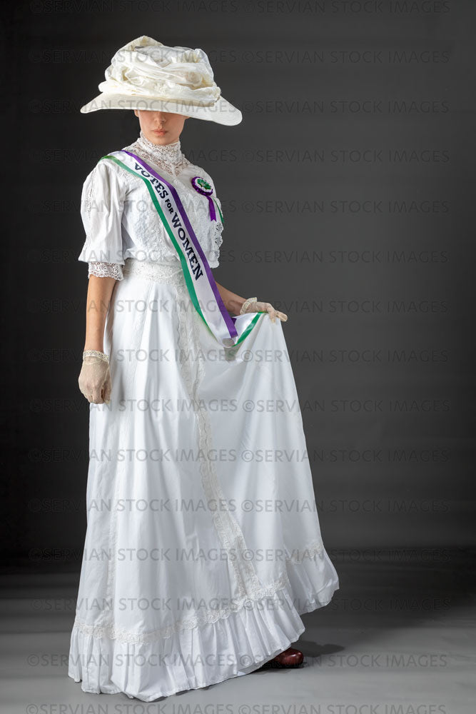 United Kingdom Suffragette from late 19th / early 20th century wearing a white lace blouse and skirt (SARAH 405UK)