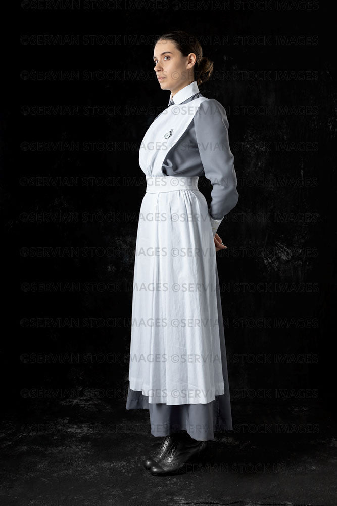 World War 1 nurse in grey uniform dress with a white apron (Sarah543)