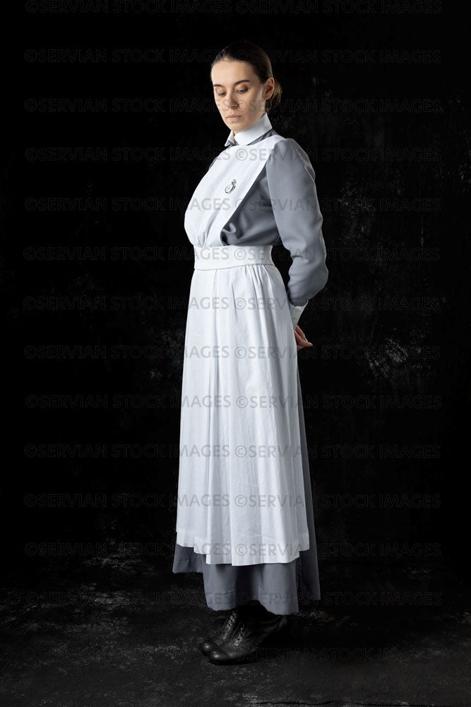 World War 1 nurse in grey uniform dress with a white apron (Sarah545)