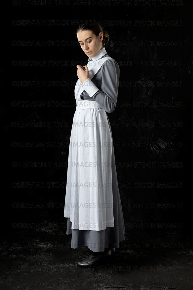 World War 1 nurse in grey uniform dress with a white apron (Sarah556)