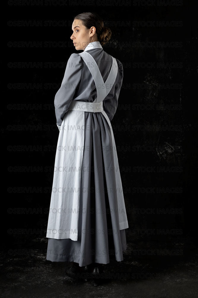 World War 1 nurse in grey uniform dress with a white apron (Sarah560)