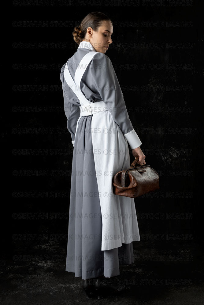 World War 1 nurse in grey uniform dress with a white apron (Sarah567)