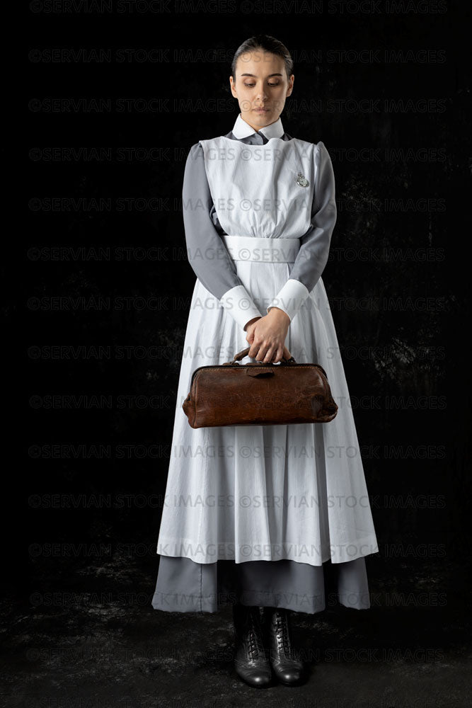 World War 1 nurse in grey uniform dress with a white apron (Sarah575)